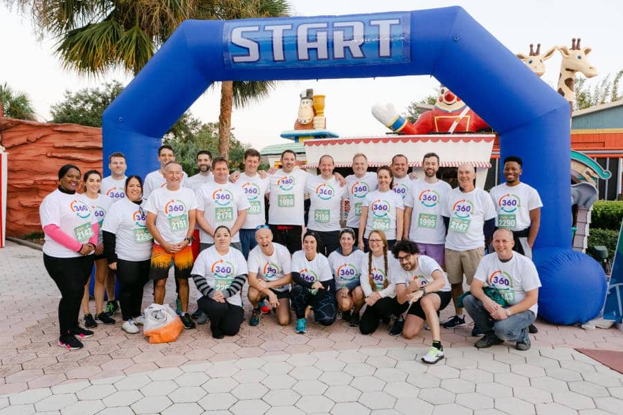 BALPPA group takes photo in front of the starting line.